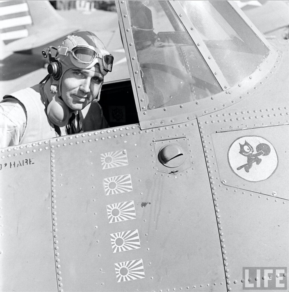 : Lieutenant Edward Henry Butch OHare in the cockpit of his Grumman F4F-3 Wildcat fighter. The Felix the Cat insignia represents Fighter Squadron 3 (VF-3).