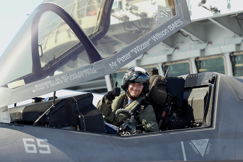 Royal Navy Commander, Nathan Gray in his Lockheed Martin F-35B Lightning II fighter jet gives a celebratory thumbs up after successfully landing on board). ©  Robert Sullivan