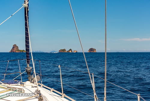 Sailing yacht near Phi Phi islands in our trip from Thailand to Malaysia. Islands, sails, blue water, and full relax        XOKA8089bs ©  Phuketian.S