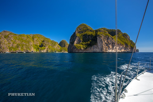 Sailing yacht near Phi Phi islands in our trip from Thailand to Malaysia. Islands, sails, blue water, and full relax        XOKA8409bs ©  Phuket@photographer.net