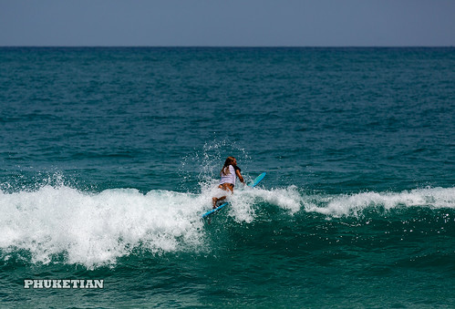 Girl in thongs on the surf on the waves    XOKA5745bs ©  Phuket@photographer.net