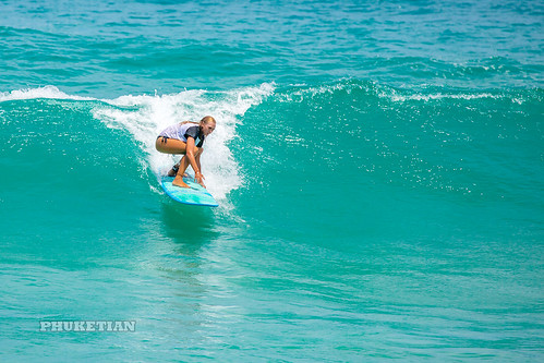 Girl in a bikini on a surf on a high wave. Nai Harn Beach, Phuket, Thailand                  XOKA5751bs ©  Phuket@photographer.net