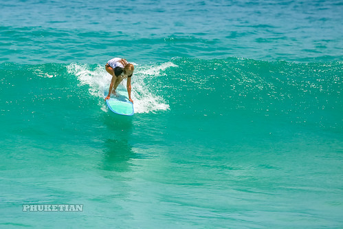 Girl in a bikini on a surf on a high wave. Nai Harn Beach, Phuket, Thailand              XOKA5749bs ©  Phuket@photographer.net