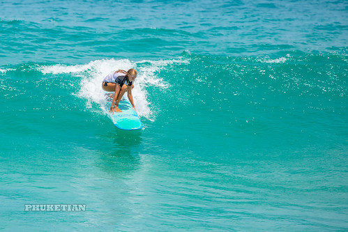 Girl in a bikini on a surf on a high wave. Nai Harn Beach, Phuket, Thailand                XOKA5750bs ©  Phuket@photographer.net