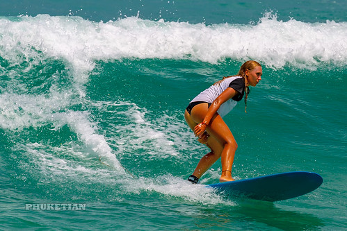 Girl in a bikini on a surf on a high wave. Nai Harn Beach, Phuket, Thailand                  XOKA5753b4s ©  Phuket@photographer.net