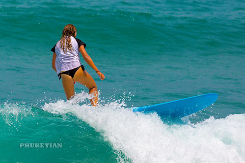 Girl in a bikini on a surf on a high wave. Nai Harn Beach, Phuket, Thailand   XOKA5759b3s ©  Phuket@photographer.net