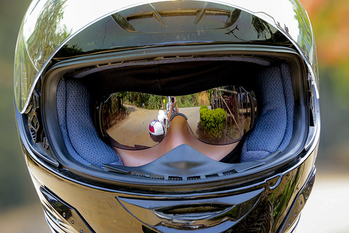 A girl in a motorcycle helmet and mirrored glasses, which reflects the photographer   AD4A3237bs ©  Phuket@photographer.net