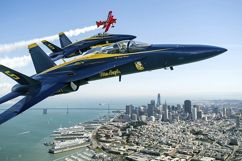 In advance of Fleet Week performances, the U.S. Navy 'Blue Angels' and 'Team Oracle' aerobatics pilot Sean D. Tucker fly over the San Francisco Bay during a photo flight on Thursday, Oct. 5, 2017. ©  Robert Sullivan
