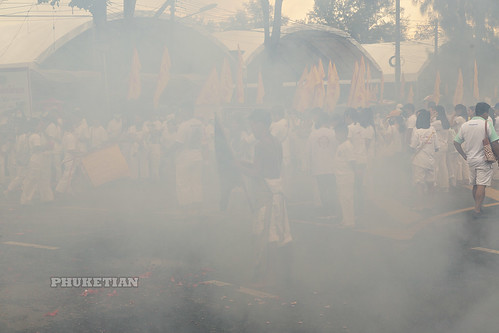 Phuket Vegetarian Festival 2019 - Everything is in smoke after constant explosions of firecrackers and fireworks during a street procession ©  Phuket@photographer.net