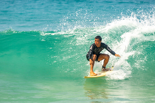 Surfing in the cool waves at Nai Harn Beach, Phuket, Thailand. ©  Phuket@photographer.net