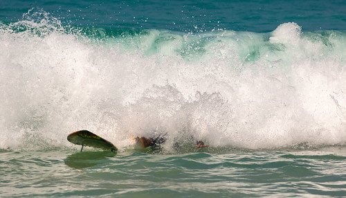 Surfing in the cool waves at Nai Harn Beach, Phuket, Thailand. ©  Phuket@photographer.net