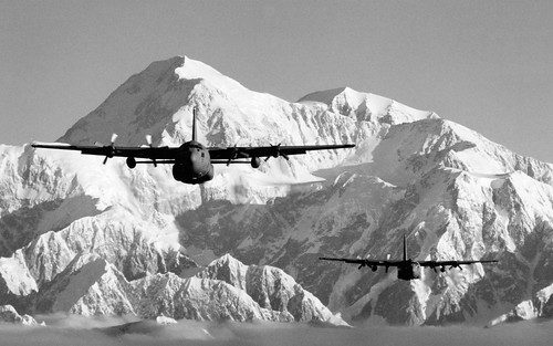 Lockheed C-130's from the Alaska Air National Guard's 176th Wing fly near Mt. McKinley. ©  Robert Sullivan