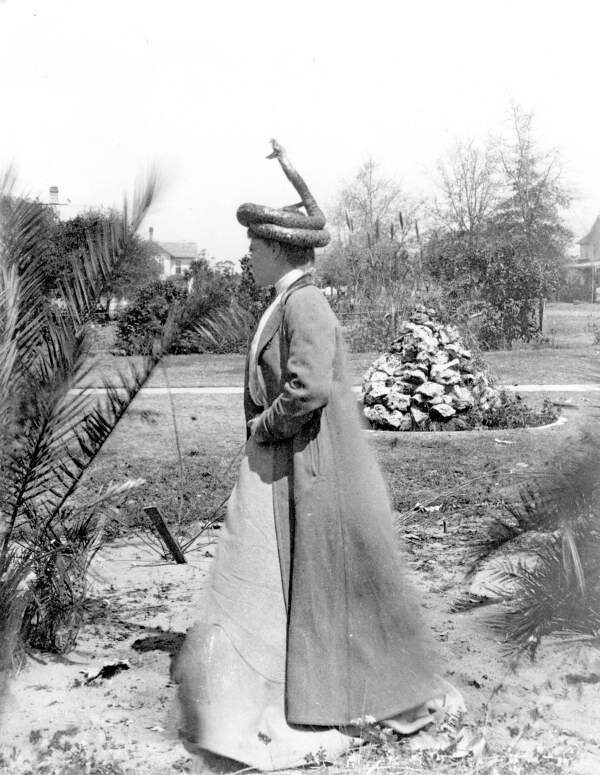 : Woman with stuffed rattlesnake hat on her head - Eustis