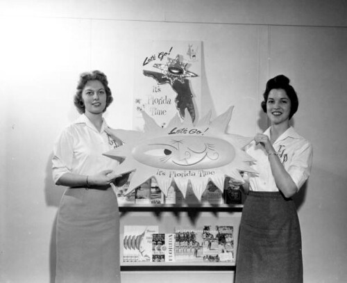 Jeanette Hand and Lee Lee Arnold pose with Florida advertisements - Tallahassee ©  Florida Memory