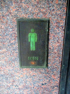 Sign for Men’s Restroom in Alcove with Restrooms at Plaza with Restrooms at Exit from East