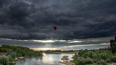 A hot air balloon over the Loire river • <a style="font-size:0.8em;" href="http://www.flickr.com/photos/125767964@N08/50422233913/" target="_blank">View on Flickr</a>