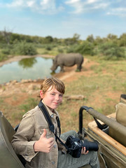 on Safari with camera and white rhino