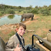 on Safari with camera and white rhino