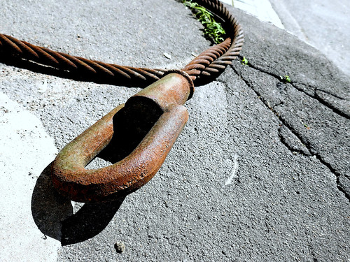 Rusty iron snake on asphalt ©  Sergei F