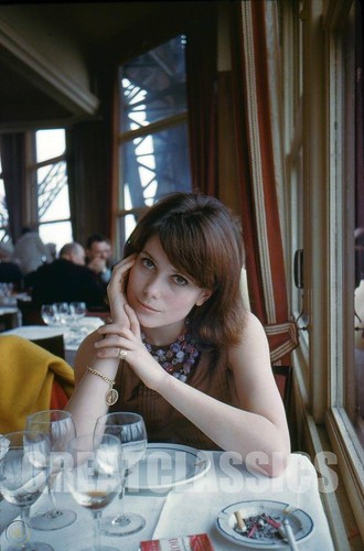 Catherine Deneuve, age 18, seated in the Eiffel Tower Cafe in Paris by Peter Basch ©  deepskyobject