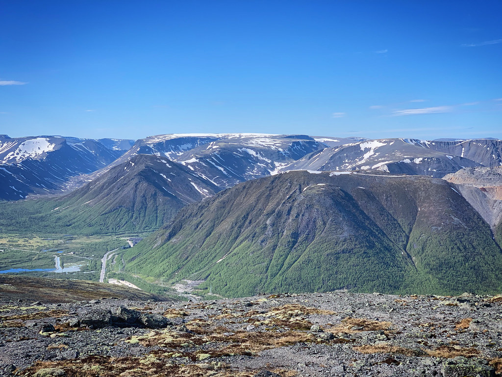 : Landscape with snow and mountains in the Khibiny mountains near Kirovsk, Russia, June 2019
