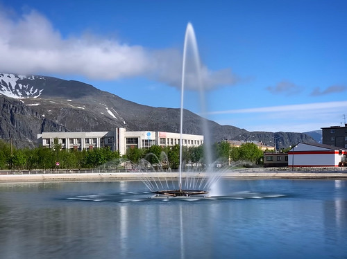 Fountain in the center of Kirovsk city with Khibiny mountains in the background, Russia, June 2019 ©  sergei.gussev