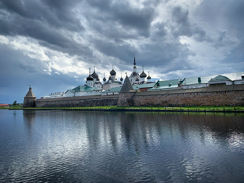 View of the Solovetski monastery under the stormy skies reflected in the lake, Solovki, Russia, June 2019 ©  sergei.gussev