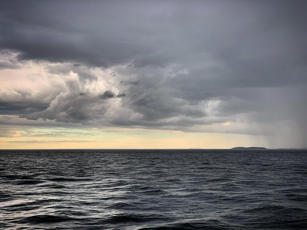 : Evening rain clouds over the White sea, Russia, June 2019