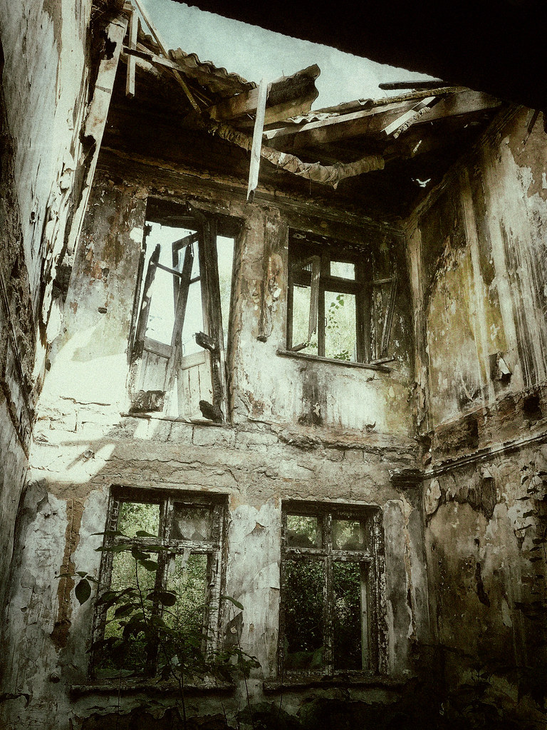 : Three windows in a decaying wall