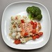 Salmon on a bed of Mashed Califlower, cherry and grape tomatoes, onions, broccoli