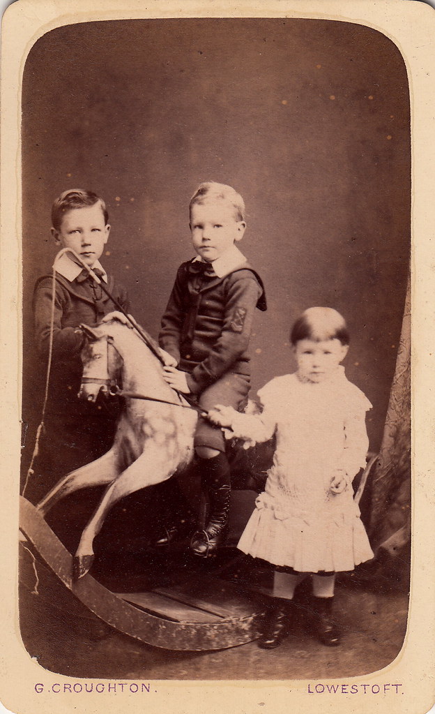 : Portrait of three children with a rocking horse by George Croughton (c.1880)