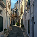 Narrow Alley Amidst Buildings In Ostuni, Italy