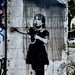 Banksy’s “Girl with Umbrella” (preserved under plexiglass)