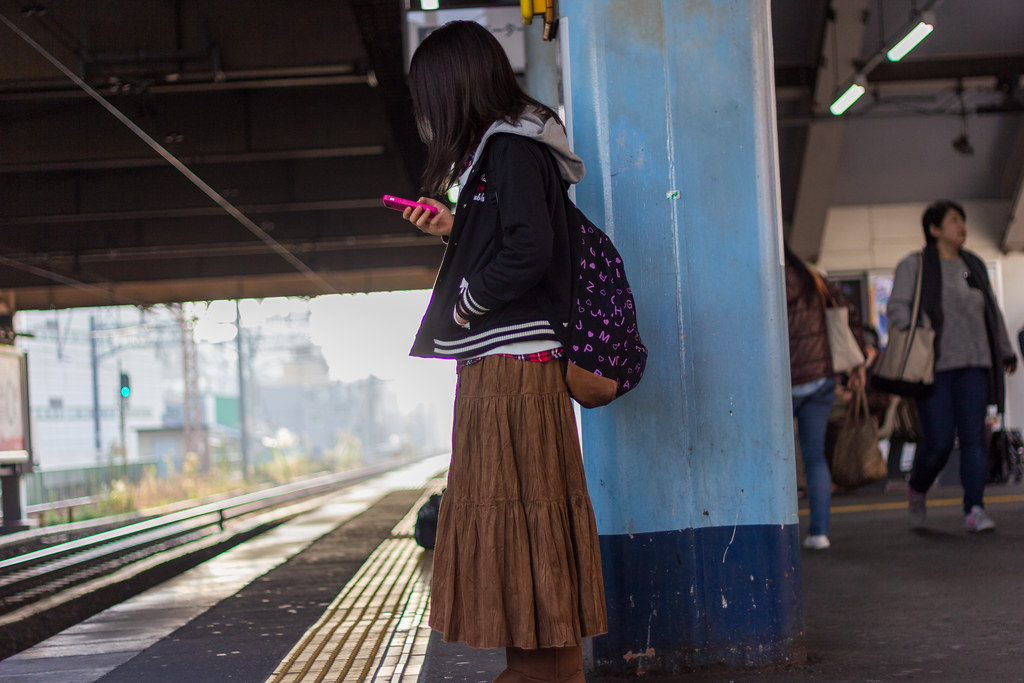 : Commuter girl on the platform
