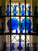 Collection of vintage blue glassware in Vita's Tower, Sissinghurst Castle, England
