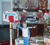 Toddler Bryan standing next to little basketball hoop