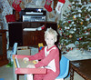 Toddler Bryan sitting at activity desk at Christmas