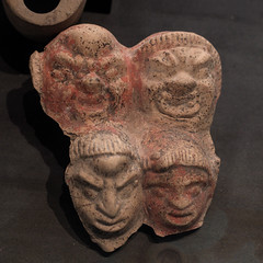 Roman terracotta plaque representing four theatrical masks from Pompeii