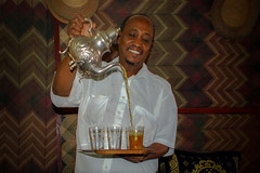 Waiter serving tea with style in Mali's capital Bamako