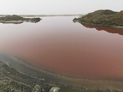Pink evaporation pond at the saltworks on the way from Walvis Bay to the open surf beach