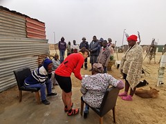 Kate reads the letter with Mamikie, the leader of a section of the community