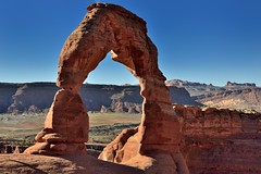 Mesa, Buttes, and Blues Skies as a Backdrop for the Delicate Arch (Arches National Park)
