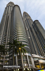 Skyscrapers of Kuala Lumpur, Malaysia. Petronas Twin Towers and other buildings XOKA7460bs
