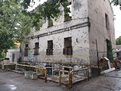 House with lots of bullit holes from the war in Mostar.