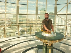 At the top of Bayterek tower to put my hand where Nursultan had his hand made into gold.