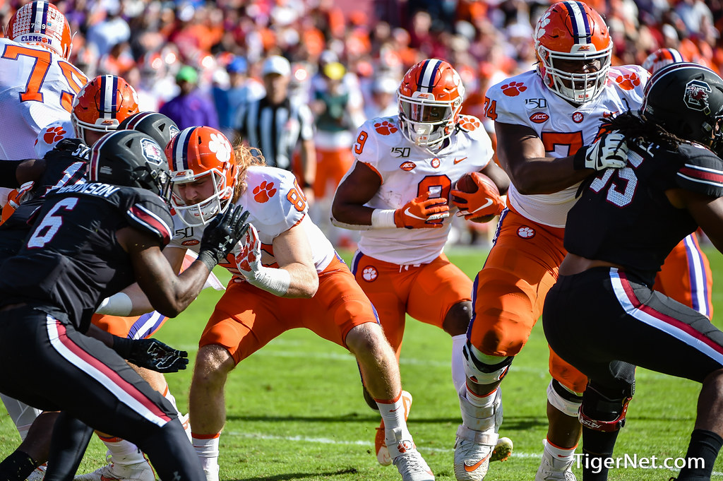 Clemson Football Photo of John Simpson and Luke Price and Travis Etienne and South Carolina