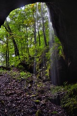 A Light Shines from Above and Across the Filaments of Water Falling (Mammoth Cave National Park)