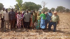 Project staff in Mali pose for a group photo with EU delegation and farmers during a field visit