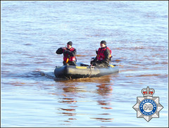 Policemen in a Dinghy ..