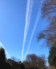 Three vapor trails showing the way
